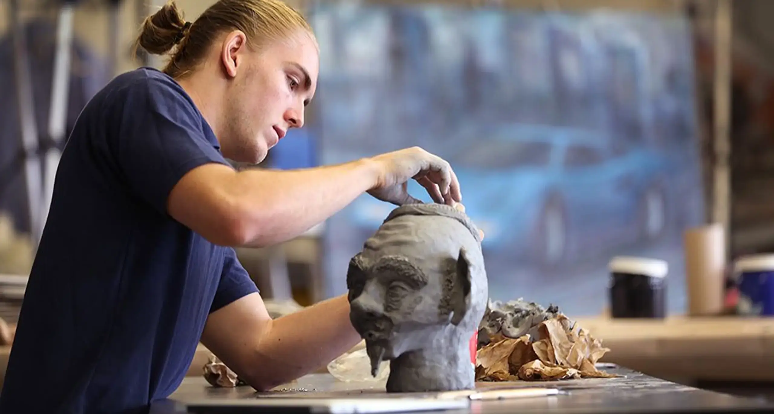 Student Sculpting with Clay