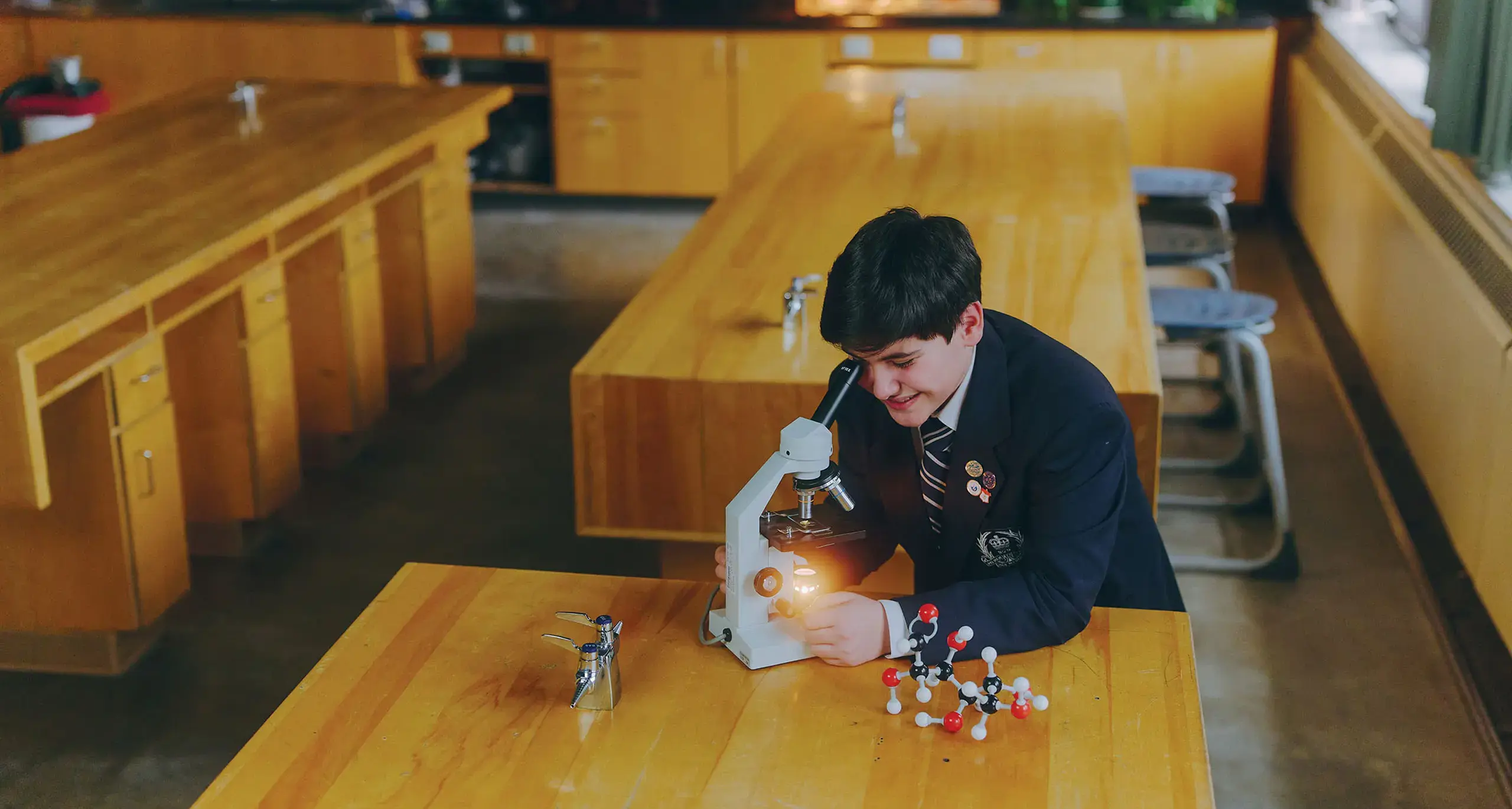 Student Studying Microscope