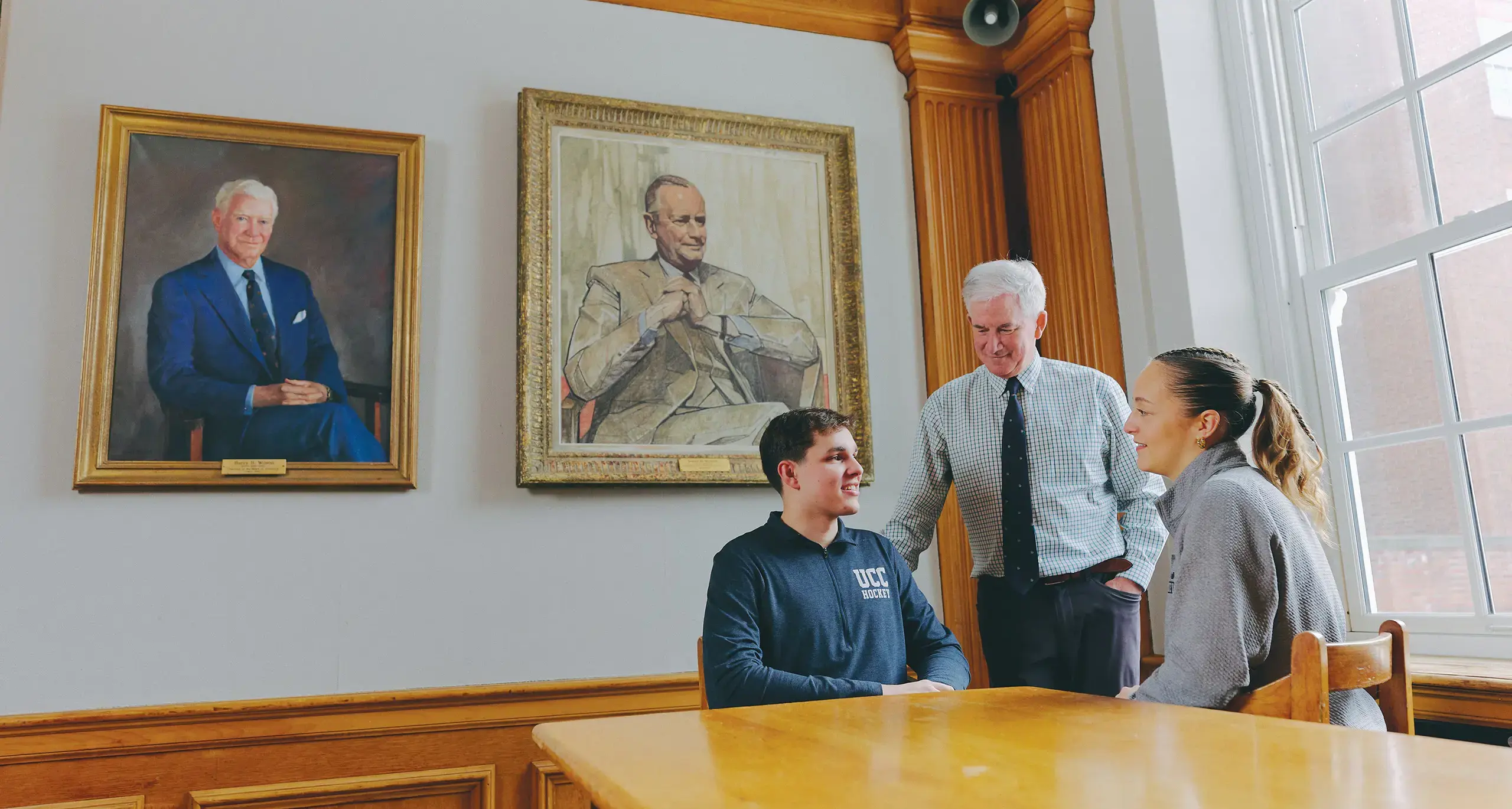 Teacher and Mentor Chatting with Student